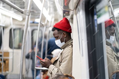 Premium Photo Afro American Passenger Man In Subway Train Wear Face