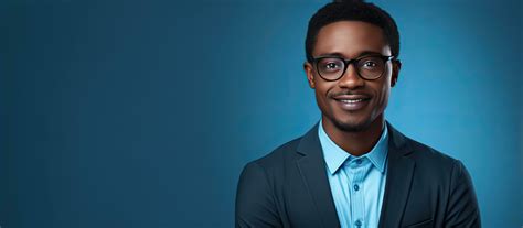 Portrait Of A Smiling African American Man Wearing Glasses Posed