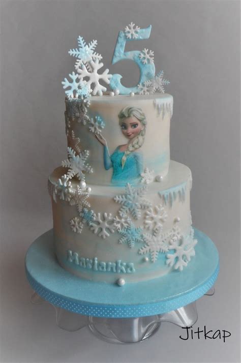 A Frozen Princess Birthday Cake With Snowflakes On It And The Number Five In The Middle