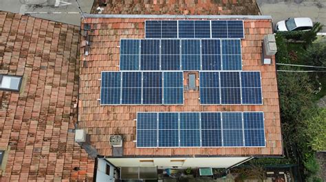 Aerial Top Down View Of Solar Panels Modules Mounted On Roof Solar