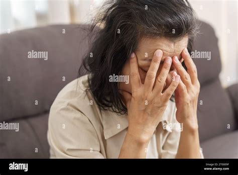 Sad Middle Age Asian Woman Touching Forehead Having Headache Suffering