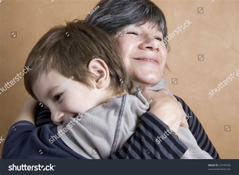 Boy Giving His Grandmother A Huge Hug Stock Photo 20745556 Shutterstock