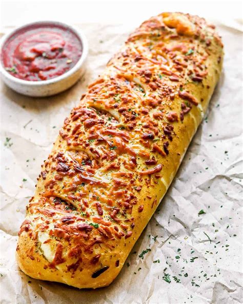 This Stromboli Is Loaded With Italian Meats Cheeses And Vegetables And All Wrapped Up I