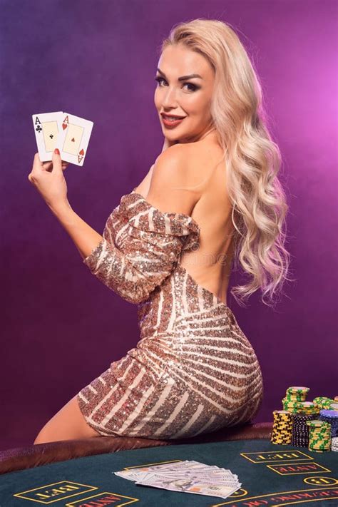 Blonde Woman With A Perfect Hairstyle And Bright Make Up Is Posing With Playing Cards In Her