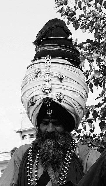 Dastar > An Akali Nihang Singh wearing a "Dastar Boonga" (towering fortified turban) embelished ...