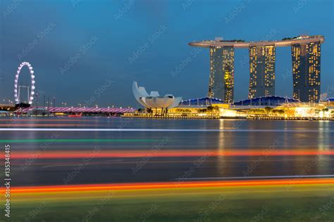 Night Time View Of Singapore Skyline With Observation Wheel Art