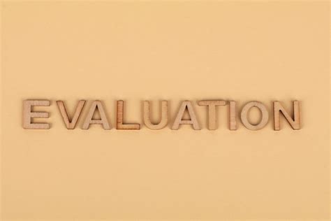 word evaluation  wooden letters  stock photo