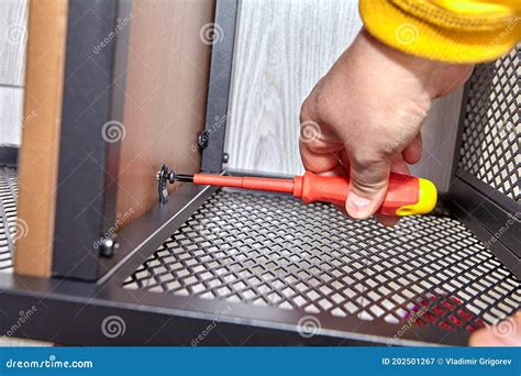 Assembler Is Mounting Metal Flat Pack Furniture Using Screwdriver Stock Image Image Of