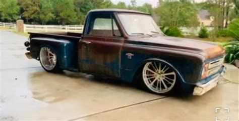 An Old Pickup Truck Parked In A Driveway