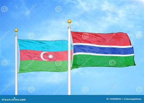 Azerbaijan And Gambia Two Flags On Flagpoles And Blue Sky Stock Image