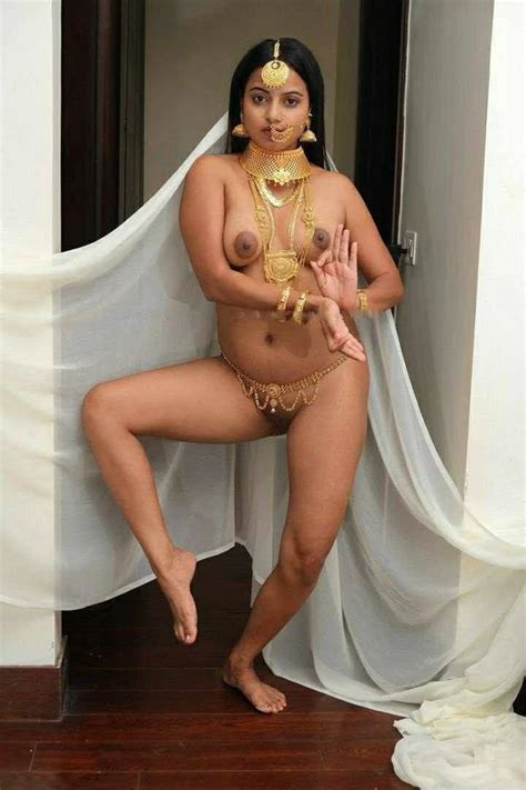 Nude Indian Lady Wearing Only Bridal Jewellery And In A Dance Pose Showcasing Her Naked Boobs