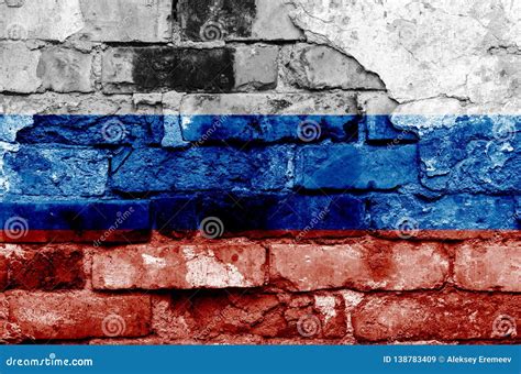 Russia Flag On A Brick Wall Background With Broken Plaster Stock