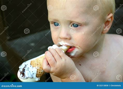 Messy Baby Eating Ice Cream Cone Stock Photo Image Of Melting