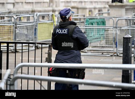 Back View Of Female Police Officer Entrance To Downing Street