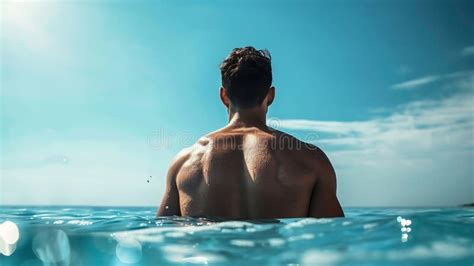 Generative Ai Low Angle Back View Of Athletic Man With Naked Torso Standing Behind Rippling Blue