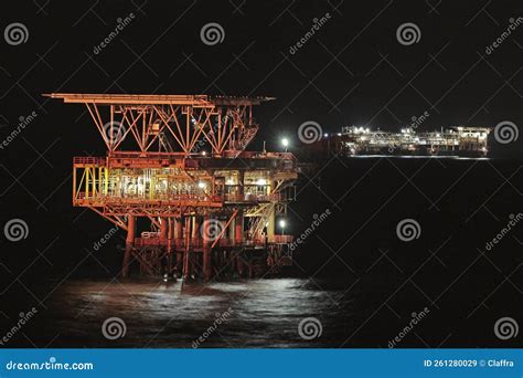 Offshore oil rig at night editorial stock image. Image of night - 261280029