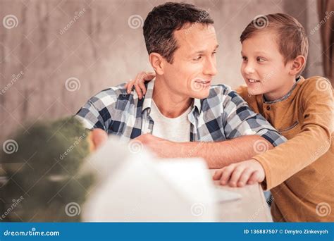 Blonde Haired Son Wearing Yellow Shirt Hugging His Father Stock Image Image Of Love Care