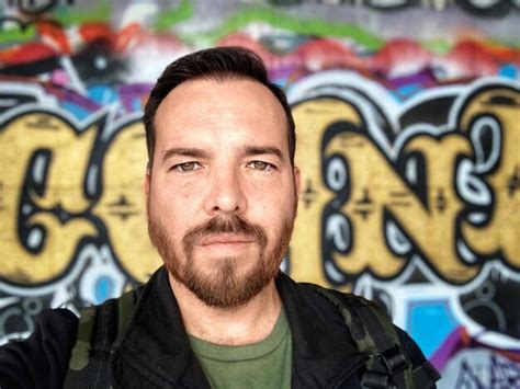 Premium Photo Portrait Of Man Standing Against Graffiti Wall