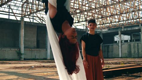 an Asian man approached and saw someone hanging with a white cloth ... 