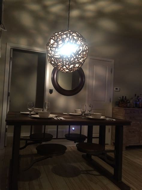 world market galvin cafeteria table  wooden orb light