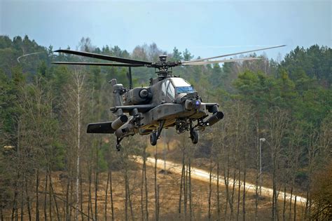 A U S Army AH 64 Apache Helicopter Provides Aerial Security During An