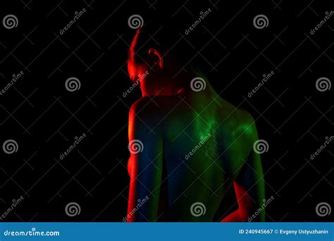 Naked Woman Silhouette In Color Lights Graceful Girl Stock Image