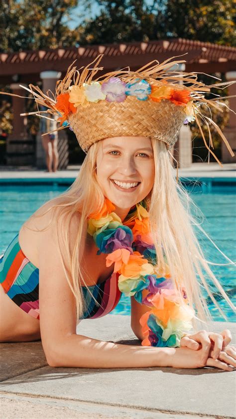 Smiling Woman In Blue And White Striped Bikini Top Wearing Brown Sun