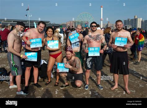 Participants in the annual Polar Bear Club swim in the icy waters off ...