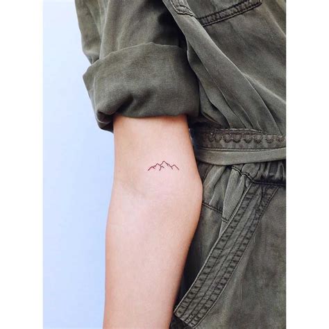 Tiny mountain range tattoo by Zaya Hastra - Tattoogrid.net