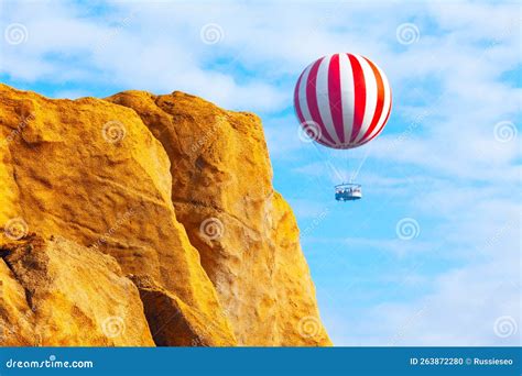 Hot Air Balloon Flying Over The Mountains Stock Photo Image Of