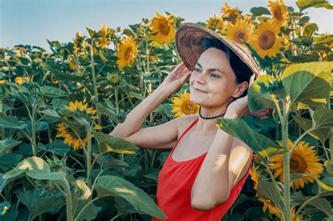 Beautiful Caucasian Woman In Sunflowers Portrait Of A Woman Wearing A