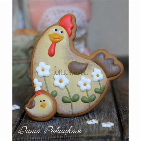 A Ceramic Chicken And Chick Sitting On Top Of A Table