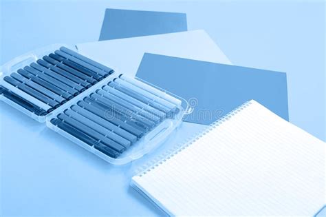 Trendy White And Blue Monochromatic Stationery Items Stock Photo