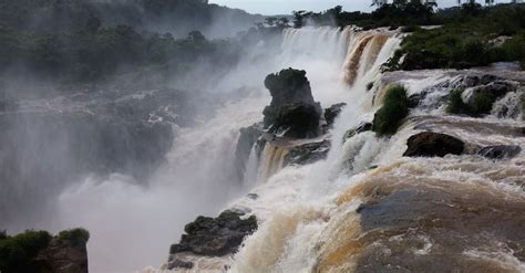 Water Falls Under White Clouds And Blue Sky During Daytime · Free Stock