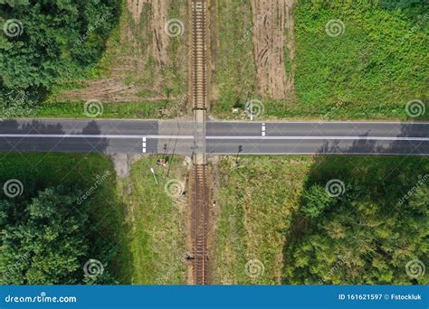 Aerial Drone Top Down View on Railroad Crossing with Asphalt Road in the Forest Stock Image ...