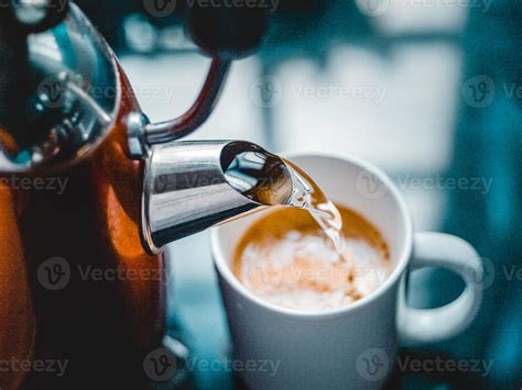 Pouring Hot Water Into A Mug For Coffee Stock Photo At Vecteezy