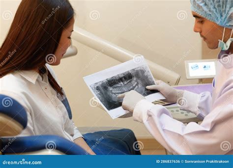 Dentist Doing Dental Xray Bite-wing Projections Show Crowns of the Maxillary and Mandibular ...