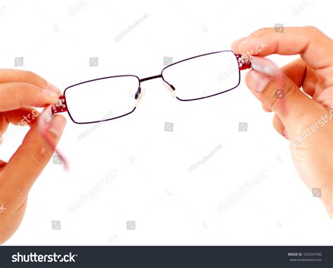 Hands Holding Glasses Isolated Over A White Background Stock Photo