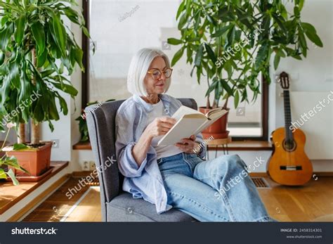 Beautiful Mature Woman Reading Book Feeling Stock Photo 2458314301