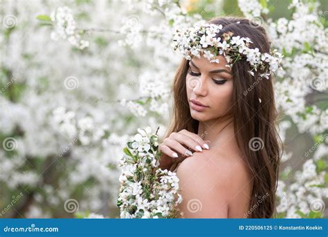 Sensual Nude Woman With Wreath And Cherry Branches Enjoys The Summer