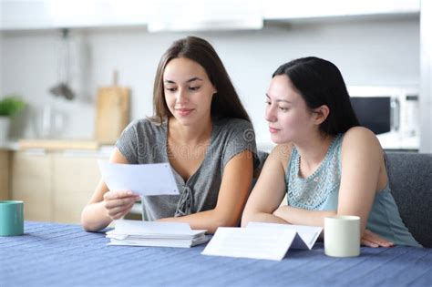 Interracial Lesbian Couple Roommates Checking Bill Stock Photos Free Royalty Free Stock