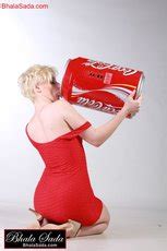 Stunning Blonde Babe Posing Erotically In A Red Dress Photos