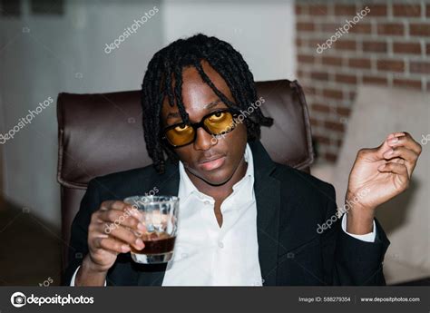 Black Man Dreadlocks Wearing Suit Having Drink Stock Photo by ©Cavan ...