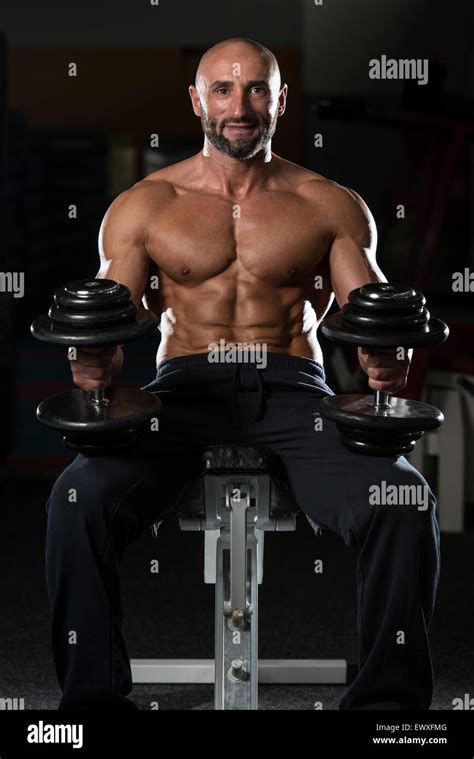 Portrait Of A Physically Fit Mature Man In A Healthy Club Stock Photo
