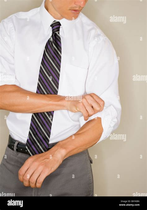 Businessman Rolling Up Sleeves Hi Res Stock Photography And Images Alamy