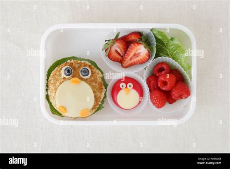 penguin healthy lunch box, fun food art for kids Stock Photo - Alamy