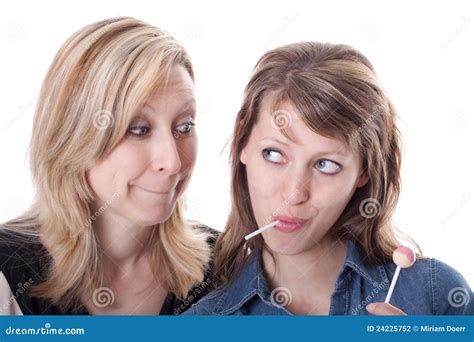 Blond Woman Wants Lolly From Brunette Woman Stock Photo Image Of Isolated Blue