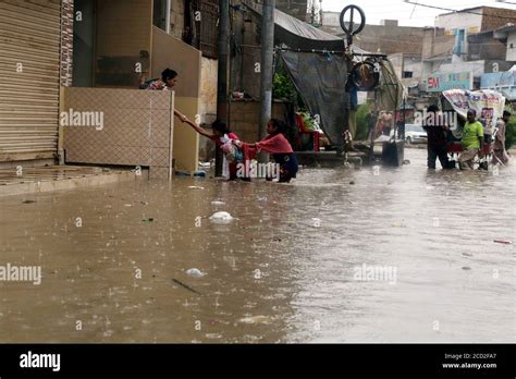 200826 KARACHI Aug 26 2020 Xinhua People Wade Through