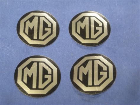 Mgb Set Of 4 Rostyle Centre Cap Badges Ahh9268b Ze33 Ebay