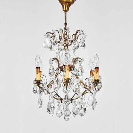 LJUSKRONA Sex ljusarmar stomme i bronserad metall senare prismor 1900 talets andra hälft